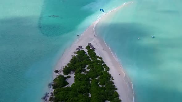 Drone view tourism of bay beach by blue water with sand background