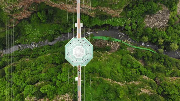 Diamond Shape Structure With Glass Bridge Over Valley