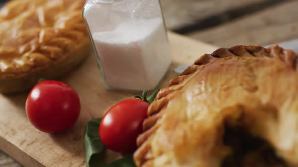 Video of pie seen from above on wooden background