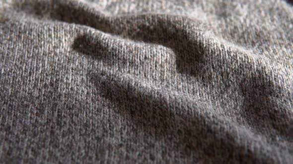 Knitted wool background. Soft, grey, woolen clothes texture, fabric sweater