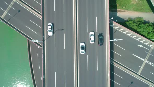 Aerial Top Down Closeup View of a Highway Overpass Multilevel Junction with Fast Moving Cars