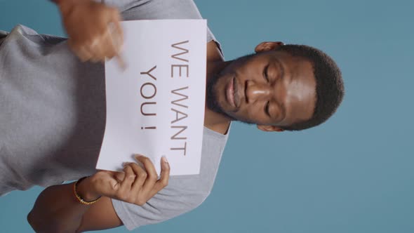 Vertical Video African American Worker Advertising Job Offer on Paper