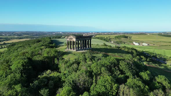 Aerial wide cinematic, push in and tilts down on Penshaw Monument in Sunderland, North East, UK. 4K