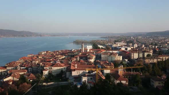 Aerial view of lake Maggiore from Rocca of Arona with sailboat and church