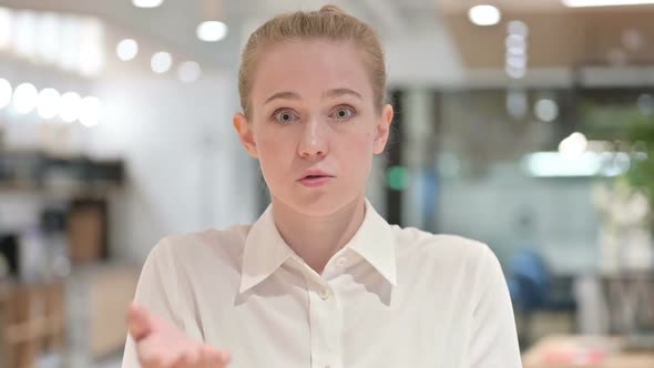 Portrait of Young Businesswoman Angry on Video Chat