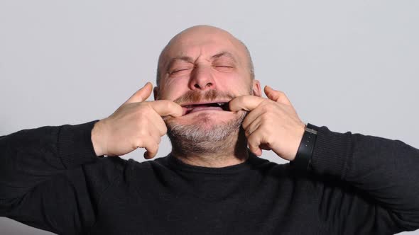 Comic Funny Bald Man He Spreading His Mouth with His Hands