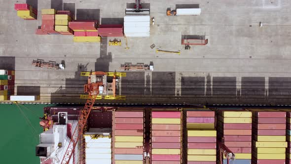 Unloading Cargo Ship In The Port