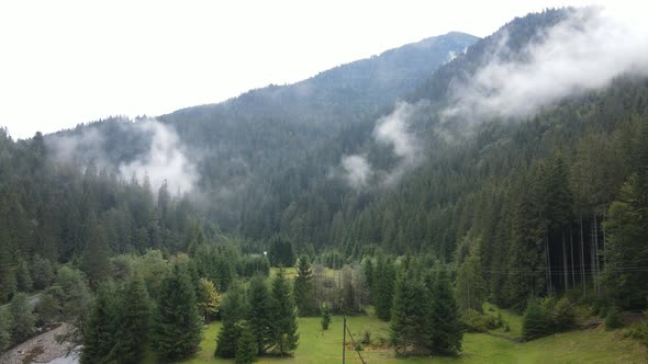 Mountains in Fog Slow Motion. Aerial View of the Carpathian Mountains in Autumn. Ukraine