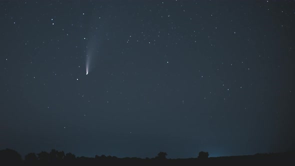 The Comet Moves Across the Night Sky Among the Stars