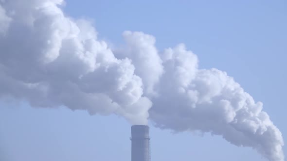 Smoke Stack with a Nice Smoke Over Blue Sky 005