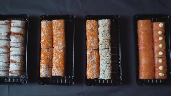 Different sets of sushi in plastic packaging