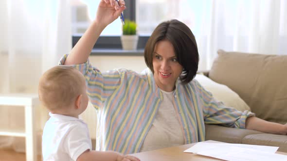 Working Mother Playing with Baby Boy at Home 12