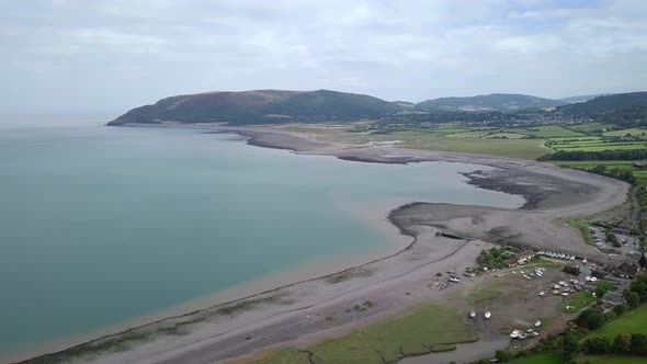 Wideshot aerial of the valley around Porlock, Somerset. The village of Porlock weir is in the foregr