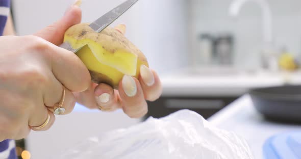 Cleaning Potatoes with a Knife