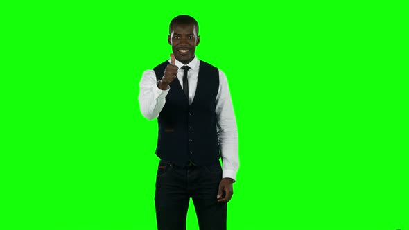 Businessman Showing a Thumbs Up Sign. Green Screen