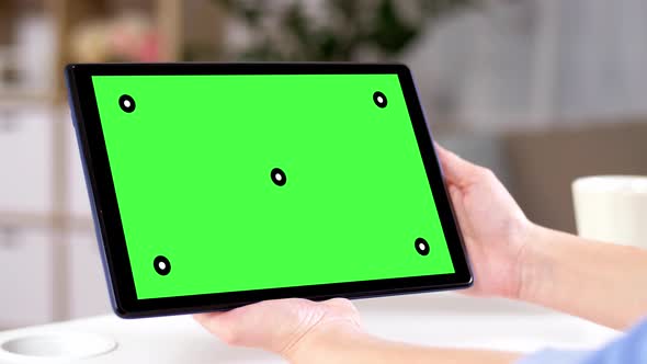 Hands Holding Tablet Pc with Green Screen at Home 141