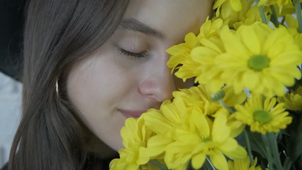 Portrait of a girl with yellow flowers.