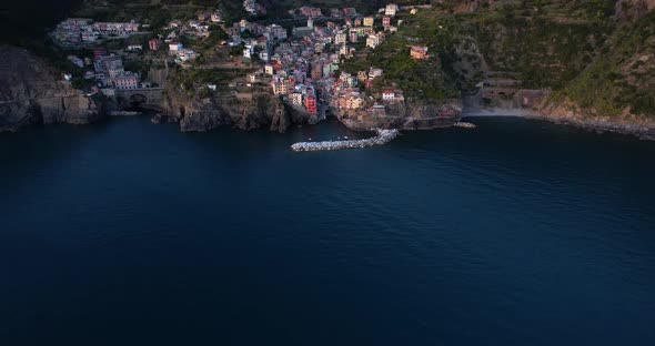 Aerial view reveals dramatic mountainous setting of Riomaggiore, Italy