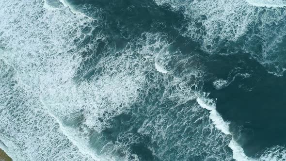 Turquoise Waters of Great Ocean, Whitecaps Rolling the Surface During Light Storm, Aerial Top Down