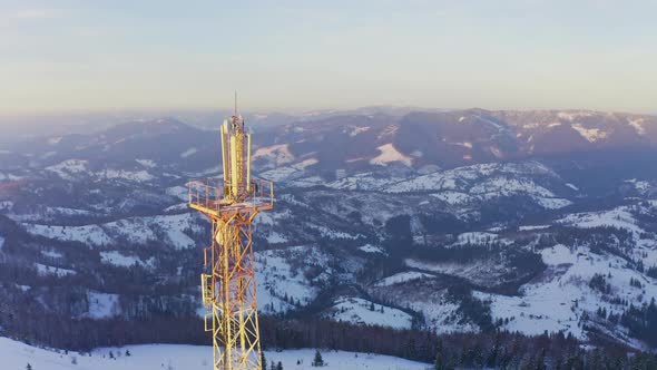 Flying Over Radio Communications Tower Mountain Snow Covered Winter Landscape