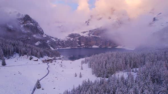 Oeschinen Lake in the Snowy Mountains of Switzerland on a Foggy Morning