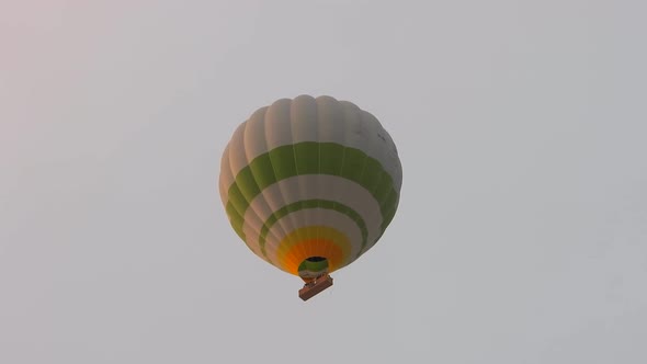 Hot Air Balloon Flying in Still Cloudless Clear Sky