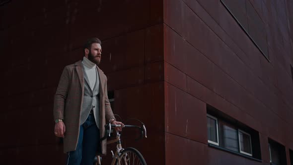 Young Man with Bicycle Going to Work