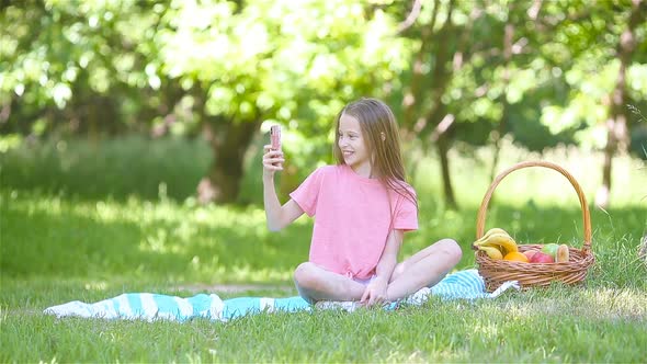 Little Girl in Yoga Position in the Park.