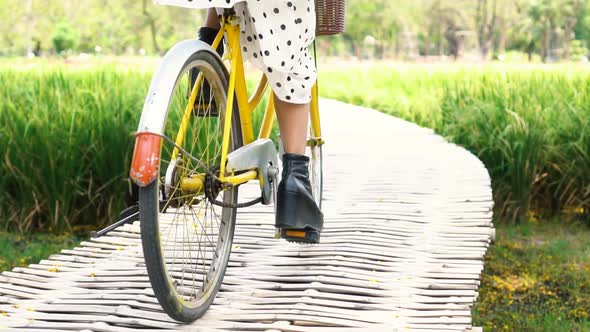 Young Woman Cycling in the Park