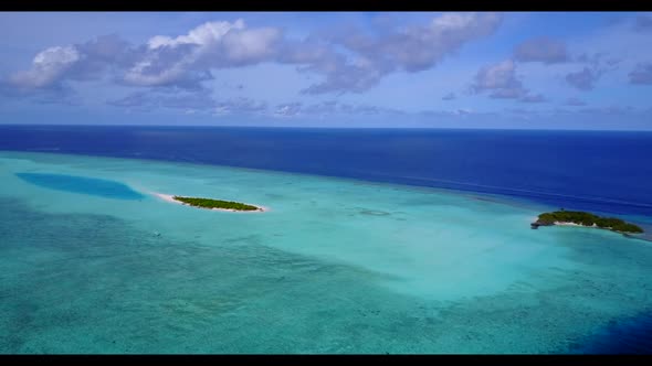 Aerial above abstract of paradise resort beach voyage by blue lagoon with bright sandy background of