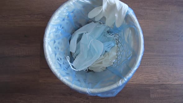 Medical Mask and Gloves Into the Bin.