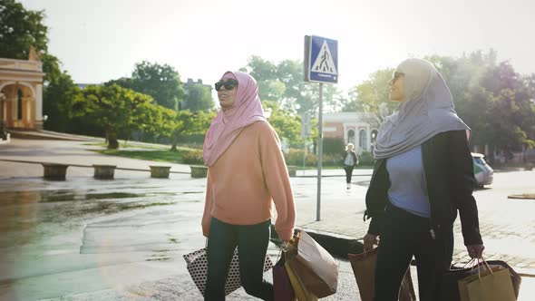 Two Muslim Females in Casual Outfit Sunglasses and Colorful Hijabs