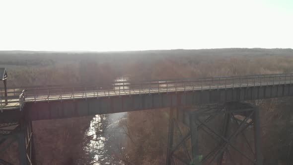 Looking out across High Bridge Trail, a reconstructed Civil War railroad bridge in Virginia. The sun