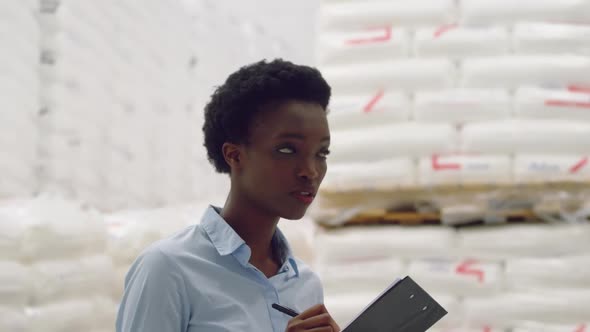 Young female manager in a warehouse