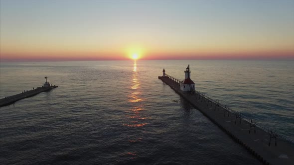 Flying towards St. Joseph lighthouse on Lake Michigan at sunset