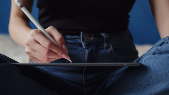 Women's Hands Draw on Digital Tablet Closeup