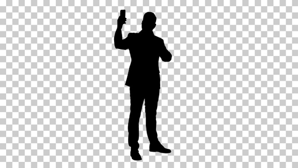 Silhouette Happy young handsome businessman recording vlog