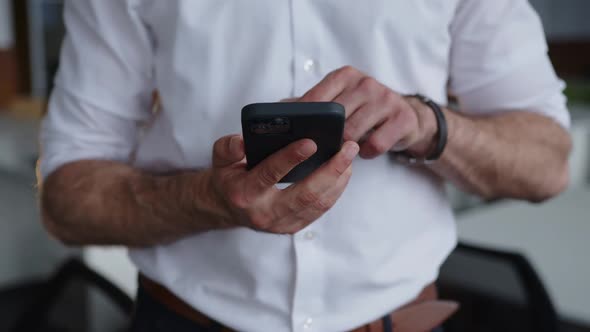 Office Worker Using His Black Phone