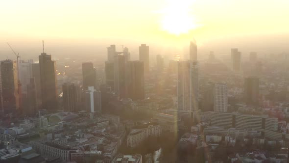 AERIAL: View of Frankfurt Am Main, Germany Skyline with Sunflair Between Skyscrapers in Beautiful