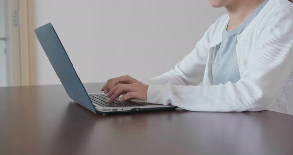 Woman work on laptop computer at home