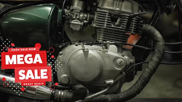 Animation of mega sale text in white and red over motorbike engine