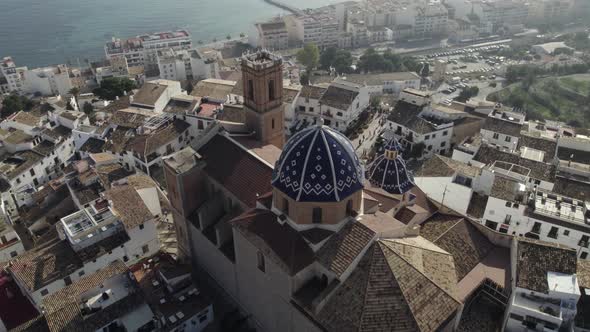 Aerial view above Church of Our Lady of Consuelo in Altea, panoramic city view