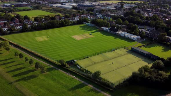 Cricket pitch and tennis courts. Aerial view in Canons Park, North London