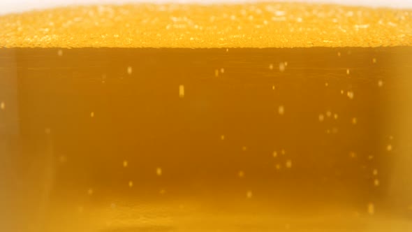 Tasty beer close-up bubbles flowing 4K 3840X2160 UltraHD footage - Beer golden color with bubbles an