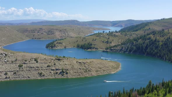 Flying over Strawberry Reservoir in Utah with boats enjoying the summer day