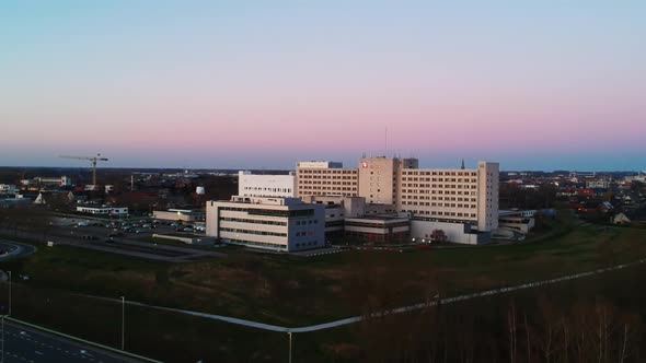 Drone overview of a hospital during sunset.