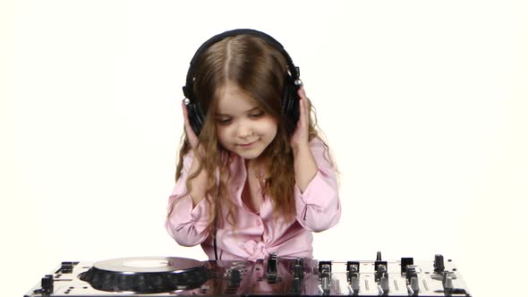 Sweet Girl with Curls Plays for Dj Console. White Background