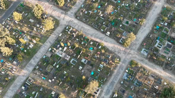 Flying over marble gravestones at cemetery.