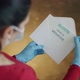 Woman Opening Envelope with Certificate with Negative Results in Covid-19 - VideoHive Item for Sale