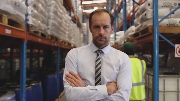 Portrait of male manager smiling in a warehouse 4k